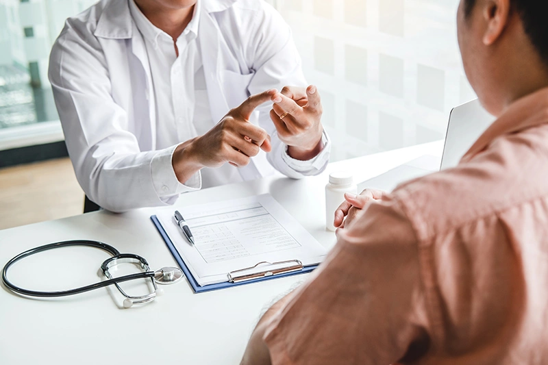 An eczema doctor in Singapore discussing treatment options with a patient.